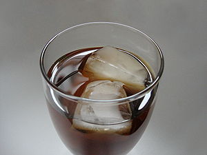 Ice cubes in a glass of iced tea. Lighting con...